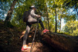 © Novak - Active female hiker walking and exploring forest