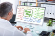 © Andrey Popov - Businessman Making Mind Map Chart On Computer
