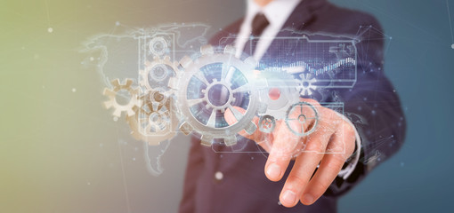 Poster - Man holding a technology gear wheel interface3d rendering