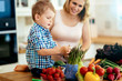 © NDABCREATIVITY - Mother and child preparing lunch