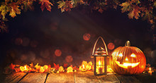 Halloween Pumpkin With Lantern On Wooden