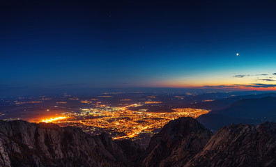 Wall Mural - sunset over the mountain hills and sliven city, aerial panoramic view