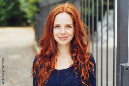 Pretty young woman with gorgeous curly red hair Poster Mural XXL