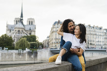 France, Paris, Happy Young Couple At River Seine