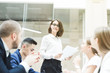 © xartproduction - Group of business meeting at the table in the modern office ,Team work and diverse hands together joining business relationships with greetings and joint business partnership.