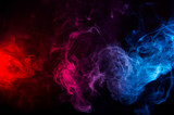 Fototapeta Tulipany - abstract shapes of mixed colors of blue and red smoke at dark background