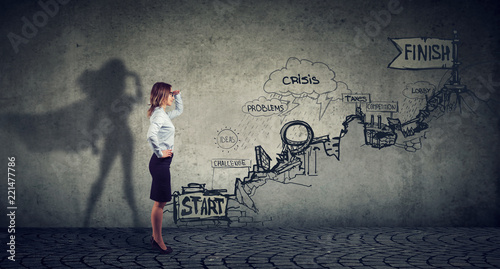 Fotografía Businesswoman imagining to be a super hero looking aspired making career plans