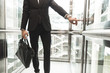 © xartproduction - Man pressing elevator button. finger presses elevator button. businessman in lift