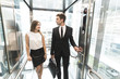 © xartproduction - successful and young businessman in the elevator business center rides to work