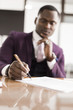 © xartproduction - African american man signing contract, black man hand putting signature on official document, biracial clients customers couple make purchase or sign prenuptial agreement concept