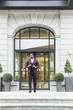 © xartproduction - stylish businesswoman with briefcase on city background. African American man talking on mobile phone