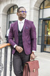 © xartproduction - stylish businesswoman with briefcase on city background. African American man talking on mobile phone