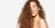 © deniskomarov - Portrait of happy young woman smiling on camera on white background. Model with curly red hair and perfect skin.  Haircare concept.