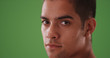 © Mark Adams - Close up portrait of handsome Hispanic man on green screen