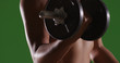© Mark Adams - Closeup of strong woman lifting weights on green screen