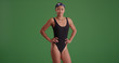 © rocketclips - Young aspiring athletic woman swimmer on green screen