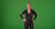 © Mark Adams - Athletic Caucasian woman in sportswear smiling at camera on green screen