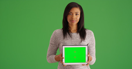 Poster - Smiling black woman holding tablet with green screen for custom content