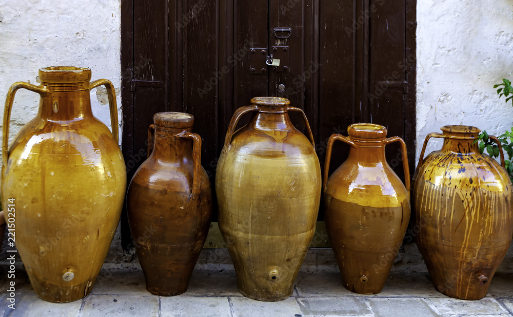 Terracotta vases of different sizes that were used in Puglia to contain ...