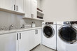 © Iriana Shiyan - White clean modern laundry room with washer and dryer