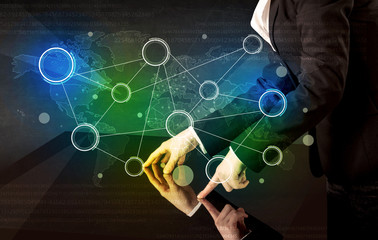 Poster - Male hands touching interactive table with colorful world map on it 