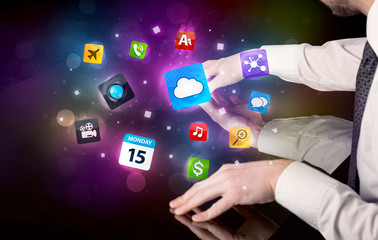 Poster - Male hands touching interactive table with colorful application icons on it 