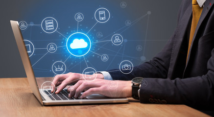 Businessman hand typing with cloud technology system and office symbol concept
