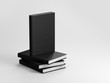 Black Textured hardcover books on gray background