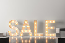 Yellow Sale Sign With Light Bulbs Over White