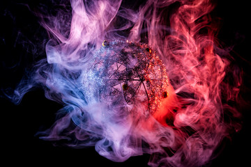 Sticker - Silver shiny decoration Christmas balls in colored purple-red smoke, on an isolated black background. Concept of a modern Christmas card. Disco-ball in colored smoke in the dark