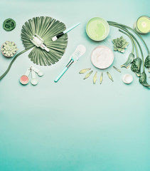 Wall Mural - natural cosmetic background. tools and accessories for home facial skin care with flowers and green 