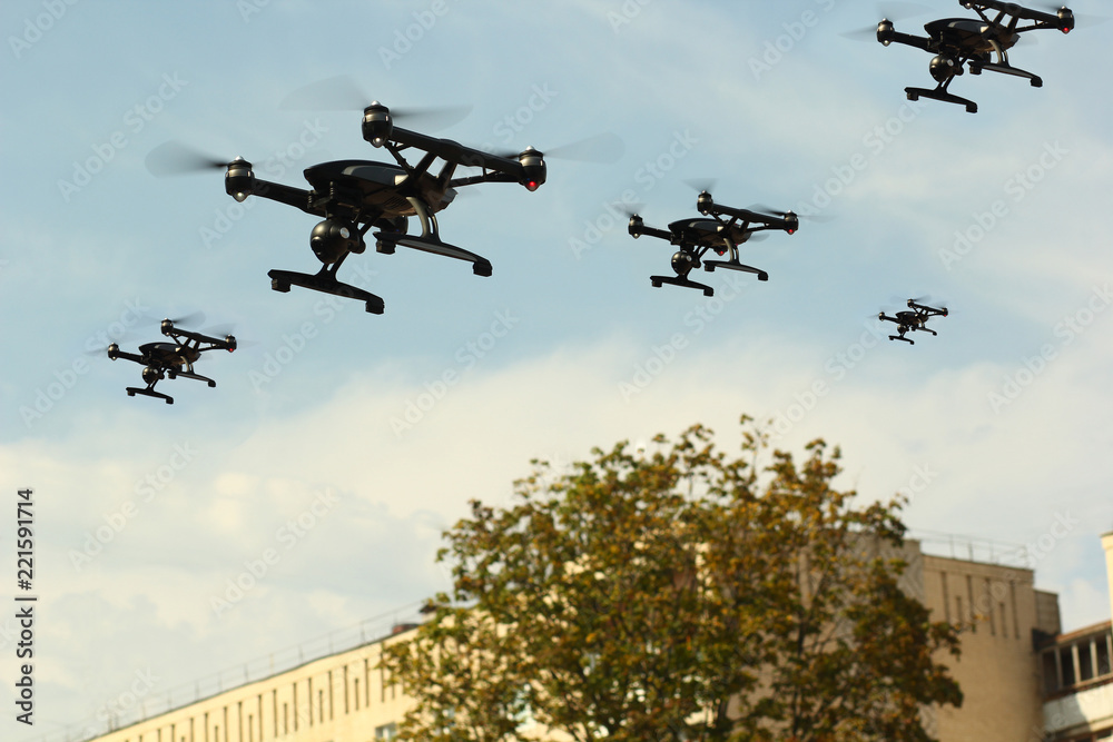 Swarm of Unmanned Aircraft System (UAV) Quadcopters Drones In The Air ...