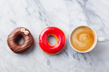 Canvas Print - Coffee with donuts on marble table background. Copy space. Top view.