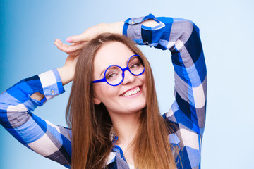 Wall Mural - Happy smiling nerdy woman in weird glasses