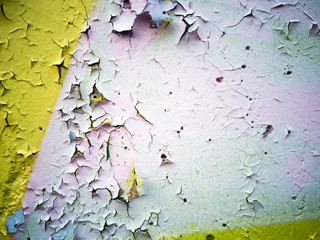 Close-up  of cracked paint on  metal wall