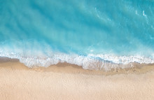 Beach And Waves From Top View. Aerial View Of Luxury Resting At Sunny Day. Summer Seascape From Air. Top View From Drone. Travel Concept And Idea
