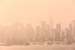 New York City midtown Manhattan skyline panorama view from Boulevard East Old Glory Park over Hudson River on a misty morning.