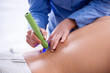 © Elnur - Patient in clinic undergoing laser scar removal