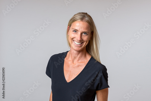 Attractive happy blond woman with a enthusiastic smile Tableau sur Toile