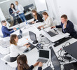 © JackF - High-angle view of business people working and communicating together
