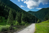 Fototapeta Natura - Roadway in the mountains, Bergamo Valley in Italy