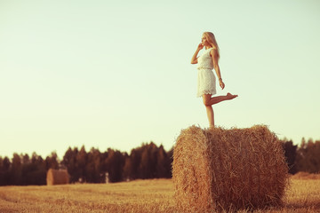 beautiful model posing outdoor nature / adult girl model outdoor nature, happy woman in a summer landscape field