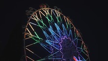 Ferris Wheel At Night In The Park. Luminescence Of The Ferris Wheel