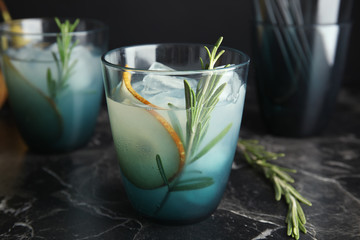 Poster - Tasty refreshing pear cocktail with rosemary on table