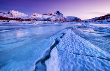 Wall Mural - Mountain ridge and reflection on the lake surface. Natural landscape on the Lofoten islands, Norway. 