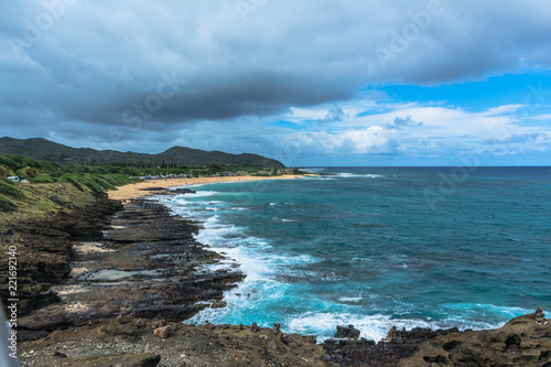 Fotografia, Obraz The rocky coast and the sand beach along Halona in Oahu, Hawaii