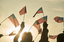 Waving American Flags, Close Up. Morning Sky Background.