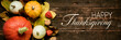 Autumn Harvest and Holiday still life. Happy Thanksgiving Banner. Selection of various pumpkins on dark wooden background. Autumn vegetables and seasonal decorations.