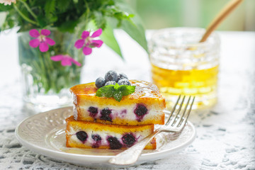 Wall Mural - Gourmet Breakfast.  French toast stuffed with Healthy cream cheese (ricotta) and blueberries with honey, fresh berries and mint. Selective focus