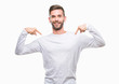© Krakenimages.com - Young handsome man over isolated background looking confident with smile on face, pointing oneself with fingers proud and happy.